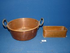 A two handled copper pan and small rectangular planter.