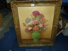 An ornately framed oil on canvas of a still life of flowers, signed H. Todd, 25'' x 29'.