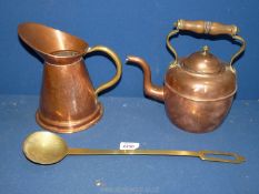 A copper kettle and jug and a long handled brass ladle.