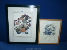 A framed and mounted Watercolour depicting a flower in a pot, initialled lower left J.K.