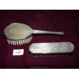A silver clothes brush and hair brush in Art Deco style, hallmarks for Birmingham circa 1954,