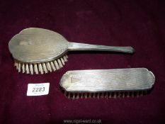 A silver clothes brush and hair brush in Art Deco style, hallmarks for Birmingham circa 1954,