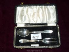 A silver child's fork and spoon set with hallmark for Birmingham, dated 1960.