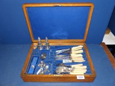 A cutlery box and contents including plated fish eaters,