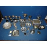 A quantity of Epns including toast rack, cruet set, cased serviette rings, lidded pots and trophies,