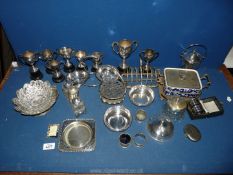 A quantity of Epns including toast rack, cruet set, cased serviette rings, lidded pots and trophies,