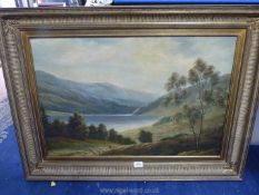 A large Oil on canvas depicting a river valley landscape with a shepherd moving sheep,