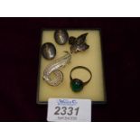 A small quantity of silver clip on earrings, ring with green stone and silver brooch.