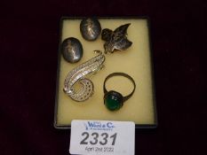 A small quantity of silver clip on earrings, ring with green stone and silver brooch.