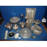 A quantity of EPNS including a vanity set, shell dish, bud vases, cake stand,