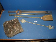 Brass and copper fire irons.