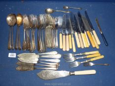 A quantity of bone and metal handled cutlery.