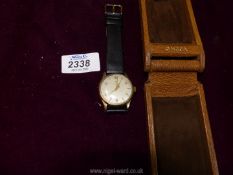 A brown leather presentation cased ''Omega'' Wristwatch having a nickel coloured face with Arabic