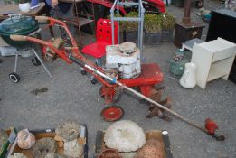 A rotavator and a brush cutter for spares.