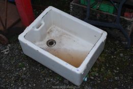 A white Belfast sink, 24'' x 18 1/2''.