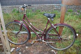 A Raleigh Cameo 3 speed step through bicycle.