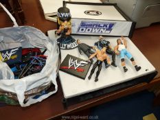 A toy wrestling ring and figures