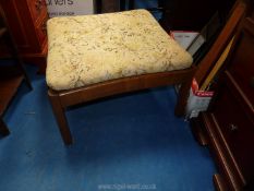 An Ercol foot stool with cushion.