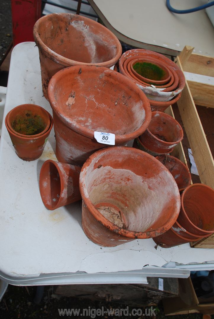 Quantity of handmade clay flower pots.