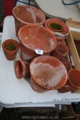 Quantity of handmade clay flower pots.