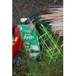 A boxed metal arch 2m high, hanging baskets and plant supports.