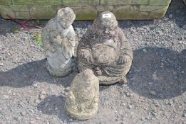 A large Buddha and a smaller Buddha and an oriental figure ornament.