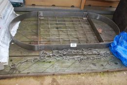 A stainless steel hanging grill/saucepan rack 33" x 16".