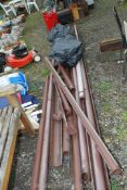 A large quantity of plastic guttering and three bags of brown fittings