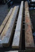Three lengths of softwood up to 180'' long and up to 8'' thick