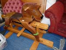 A large wooden Rocking Horse by 'It's Childsplay', 5' long.