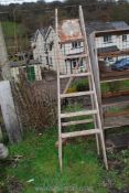 A 5 rung wooden stepladder.