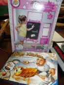 A 'Bugs in the Kitchen' board game and a child's boxed black/white board