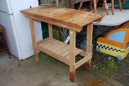 A wooden potting Table, 41" long x 21" deep x 3' high.