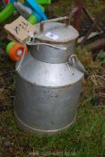 A small metal milk pail.