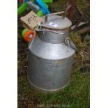 A small metal milk pail.