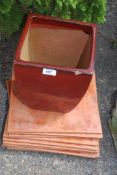 Eleven terracotta floor tiles 13" square and glazed planter, 9" x 11 1/2" tall.