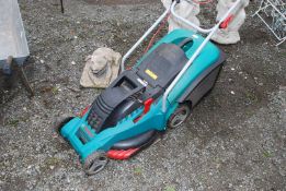 A Bosch electric mower with cable.