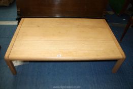 An Ash three plank low lounge table 47'' wide x 29 1/2'' deep x 12'' high.