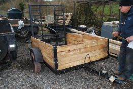 A Single Axle Trailer with mesh ramps on Indespension, 10" mini wheels, 6' long x 4' wide.