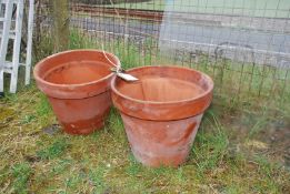 A pair of terracotta pots (1 cracked) 17" wide x 14 1/2" high.