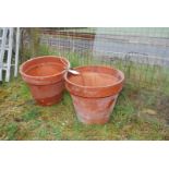 A pair of terracotta pots (1 cracked) 17" wide x 14 1/2" high.