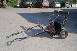 A Pony cart with full harness