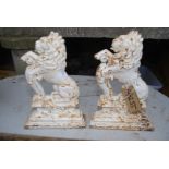 A pair of cast iron rearing lions doorstops, 15'' high.