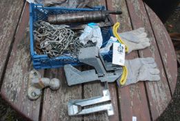 A plastic tray, grease gun, tow ball,