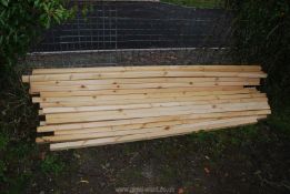 23 lengths of softwood timbers 2'' square x 89'' long.