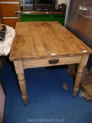 A scrubbed top kitchen table with end drawer 47 3/4" L x 30" W x 29 1/2" H.