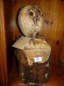 An owl tree stump sculpture