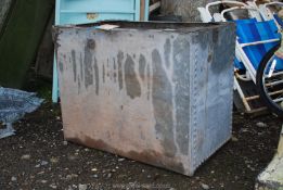 A large galvanised riveted water Tank, 39 1/2" wide x 18 1/2" deep x 2' high.