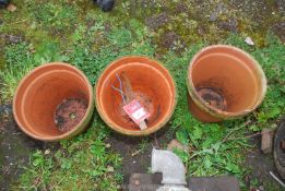 Three Terracotta flower pots.