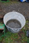 A galvanised bath, 28" x 21" x 11".